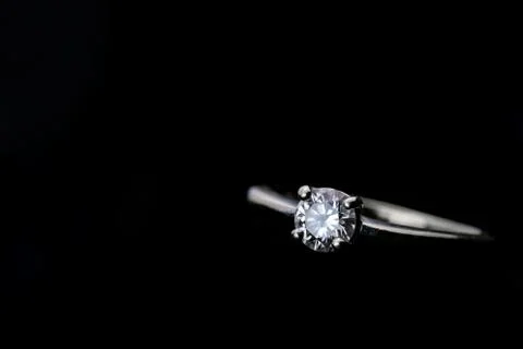 Diamond ring with copy space on black background Stock Photos