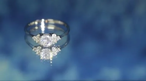 Diamond ring on dark blue background,wedding ring, engagement ring Stock Photos