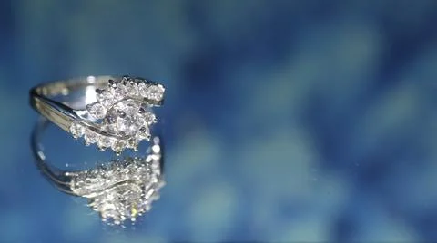 Diamond ring on dark blue background,wedding ring, engagement ring Stock Photos