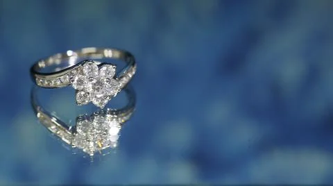 Diamond ring on dark blue background,wedding ring, engagement ring Stock Photos