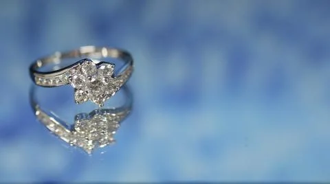 Diamond ring on dark blue background,wedding ring, engagement ring Stock Photos