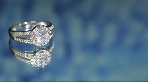 Diamond ring on dark blue background,wedding ring, engagement ring Stock Photos