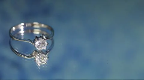 Diamond ring on dark blue background,wedding ring, engagement ring Stock Photos