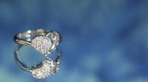 Diamond ring on dark blue background,wedding ring, engagement ring Stock Photos