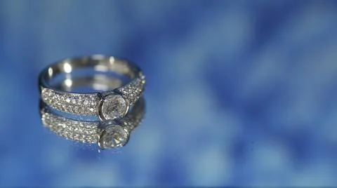 Diamond ring on dark blue background,wedding ring, engagement ring Stock Photos