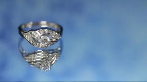 Diamond ring on dark blue background,wedding ring, engagement ring Stock Photos