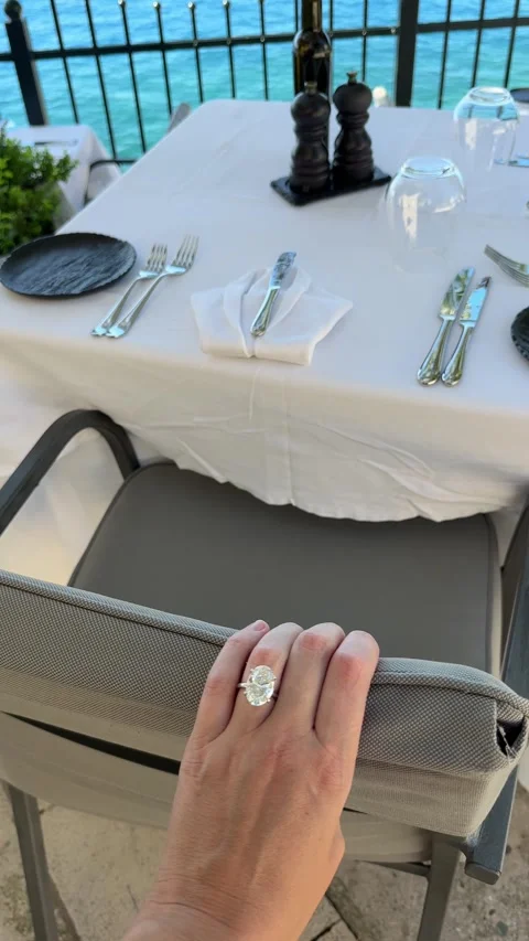Diamond ring hand on white table by the sea in Croatia Stock Footage 319693891