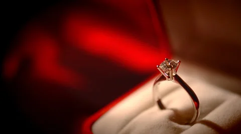 Diamond ring on red silk background Stock-Footage 34902527