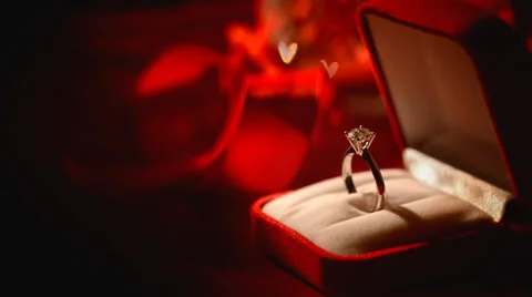 Diamond ring on red silk background | Stock Video | Pond5