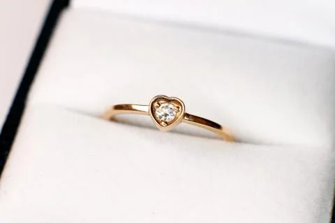 Diamond ring in the shape of heart Stock Photos