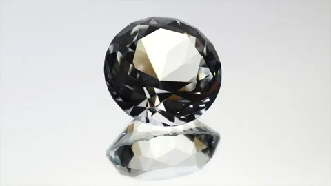 Diamond rotating over grey background with reflection. Gemstone, Clear Crystal Stock Footage 317408800