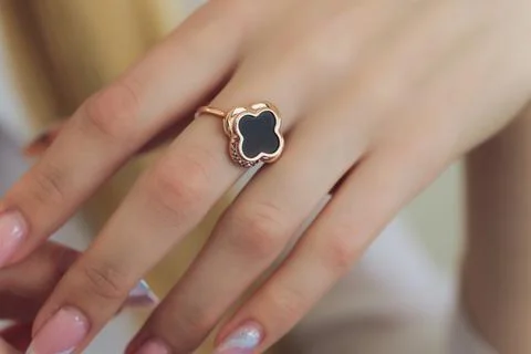 Diamond ruby ring on young model. Black dress and necklace. 스톡 사진