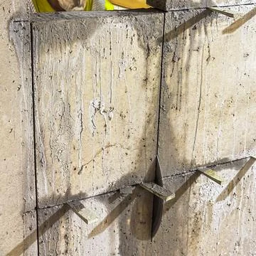 Diamond saw process modifying reinforced concrete structure. Stock Photos