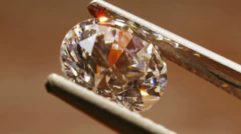 Diamond Seen Close Up With Pincers Stock Footage 22995715