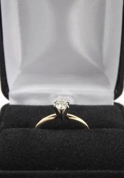 Diamond solitaire ring close-up in box Stock Photos