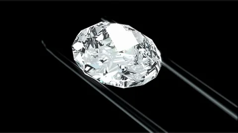 Diamond in tweezers Stock Footage 27492178