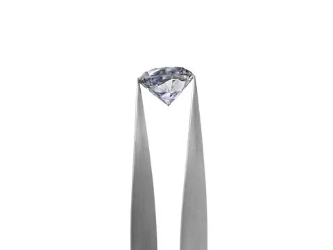 Diamond on white background held in diamond tweezers Stock Photos