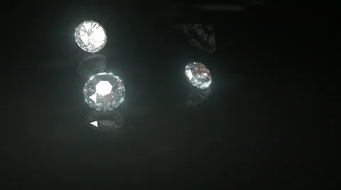 Diamonds Drop onto Shiny Black Surface Loop HD Video stock 812825