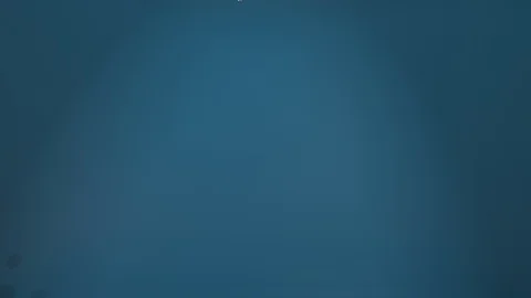 Diamonds fall in slow motion, against blue gradient Stock Footage 128875463