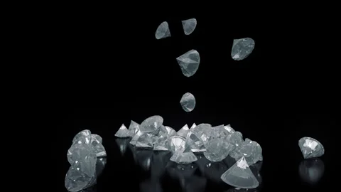 Diamonds Falling On A Reflective Surface Stock Footage 243096601