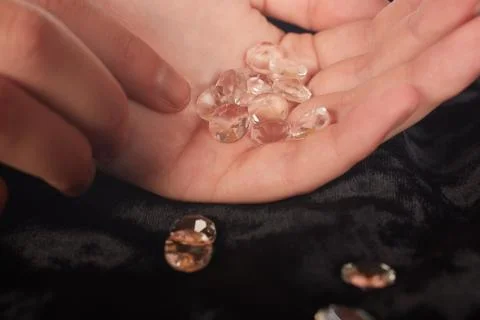 Diamonds in hand Stock Photos