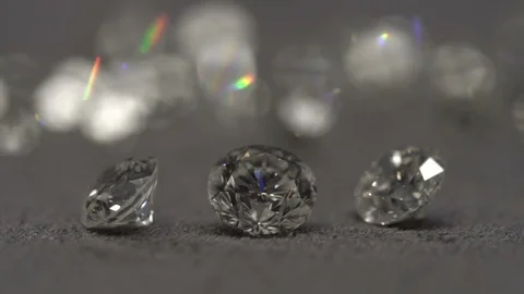 Diamonds shine on the table. Diamond macro shooting. D color diamond gems. Stock Footage 118696126