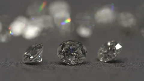 Diamonds shine on the table. Diamond macro shooting. D color diamonds Stock Footage 139631792