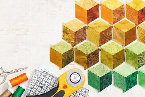Diamonds stitched in the form of a cube are prepared for sewing into a quil.. Stock Photos