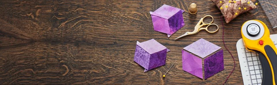 Diamonds stitched in the form of a cube. The process of sewing a quilt. Stock-Fotos