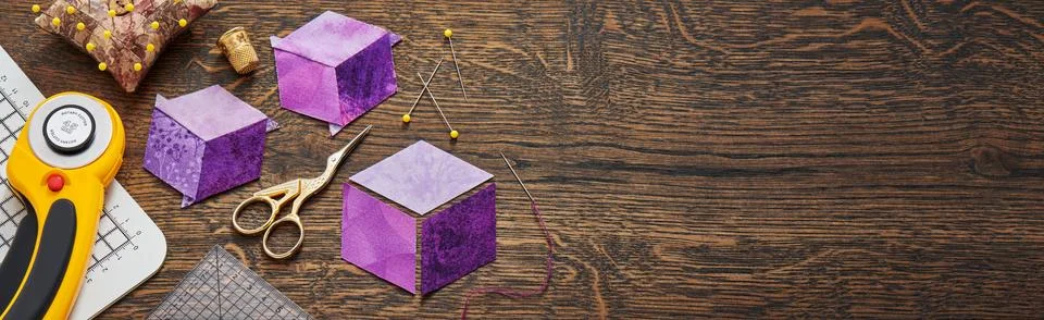 Diamonds stitched in the form of a cube. The process of sewing a quilt. Stock-Fotos