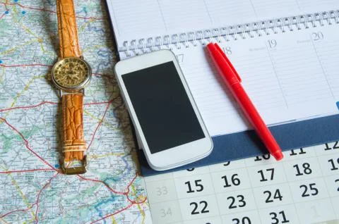 Diary and a calendar with hours, map, travel concept trip copy space Stock Photos