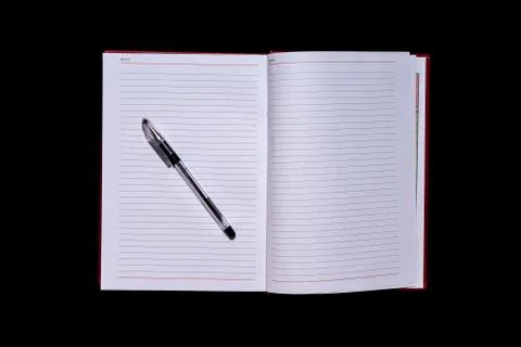 The diary with blank pages in the centre of the frame and a pen on top, a bla Stock Photos