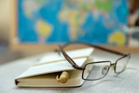 Diary, journal and reading glasses. Old-fashioned way to keep organized. Stock Photos