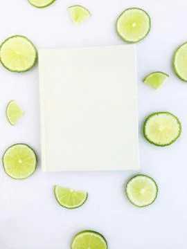 Diary with lime slice on white background Stock Photos