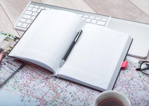 Diary notepad with accessories on table Stock Photos