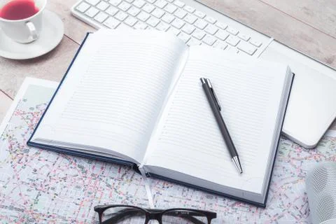 Diary notepad with accessories on table Stock Photos