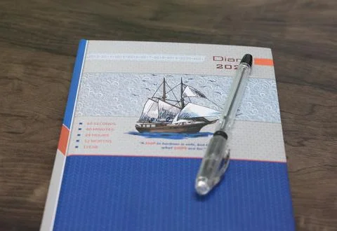 Diary with a pen on the table Foto stock