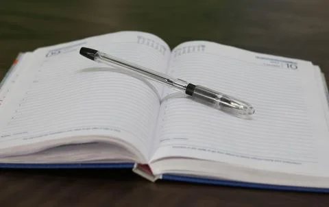 Diary with Pen on the Table Foto stock