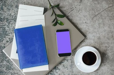 Diary, smartphone, coffee, pen - work at home concept, freelance. Stock Photos