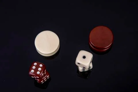 Dice and backgammon stone top view Stock Photos