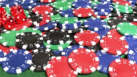 Dice and deck of playing cards on pile of chips Stock Footage 70211004