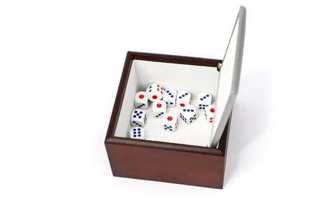 The dice are in a brown box Stock Photos