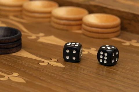 Dice on a backgammon board close-up macro Stock Photos