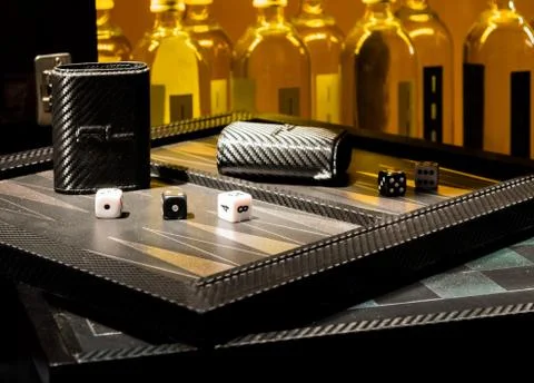 Dice, backgammon &amp; bottles Stockfoto's