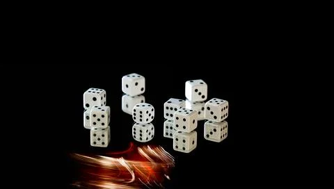 Dice on black background. Copy space Stock Photos