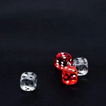 Dice on black background Stock Photos