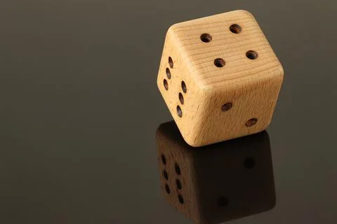 Dice on a black background. Stock Photos