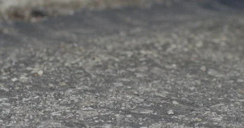 Dice bounce rolling into frame on concretre ending in 7 slow motion Stock Footage 141697459