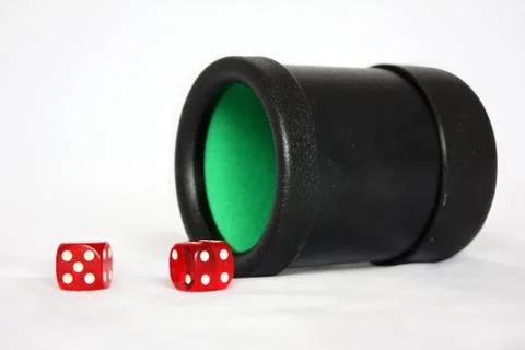 Dice cup with dice Stock Photos