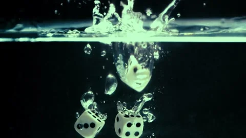 Dice Drop Below the Surface of Water Creating Splashes Stock Footage 300888008